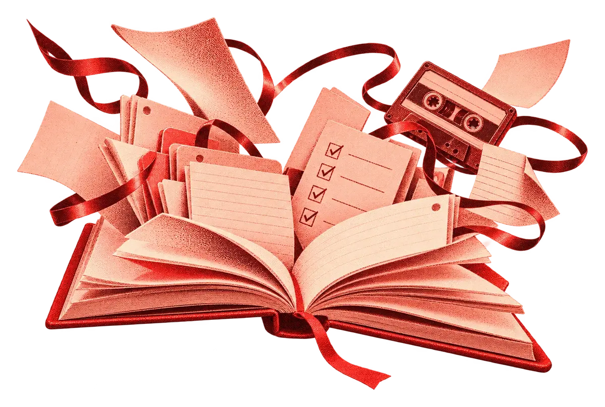 Open red notebook, notes spilling out
